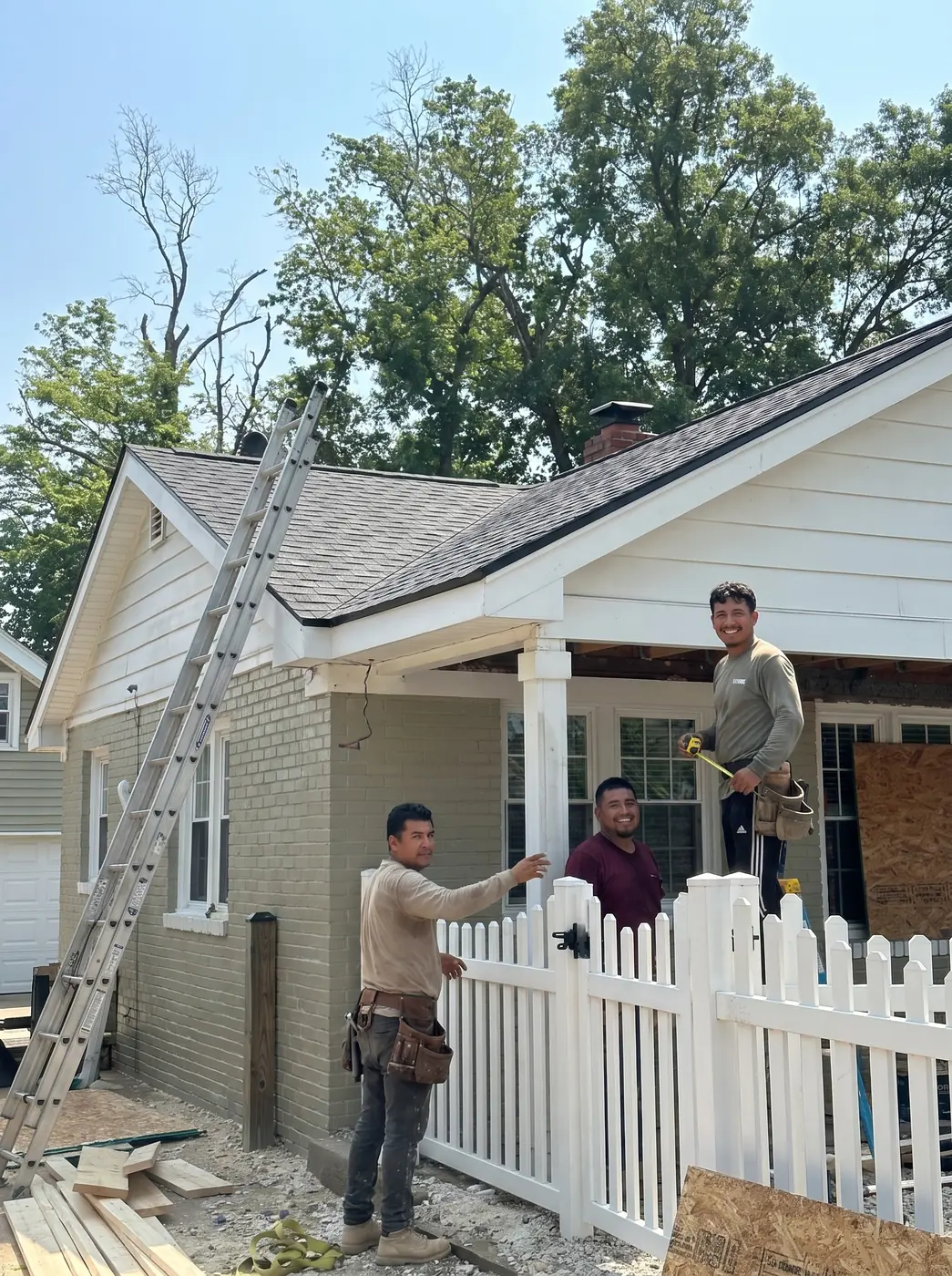 LCR crew setting a white vinyl picket fence and gate at a Northern Virginia home, completed fence install with concrete-set posts