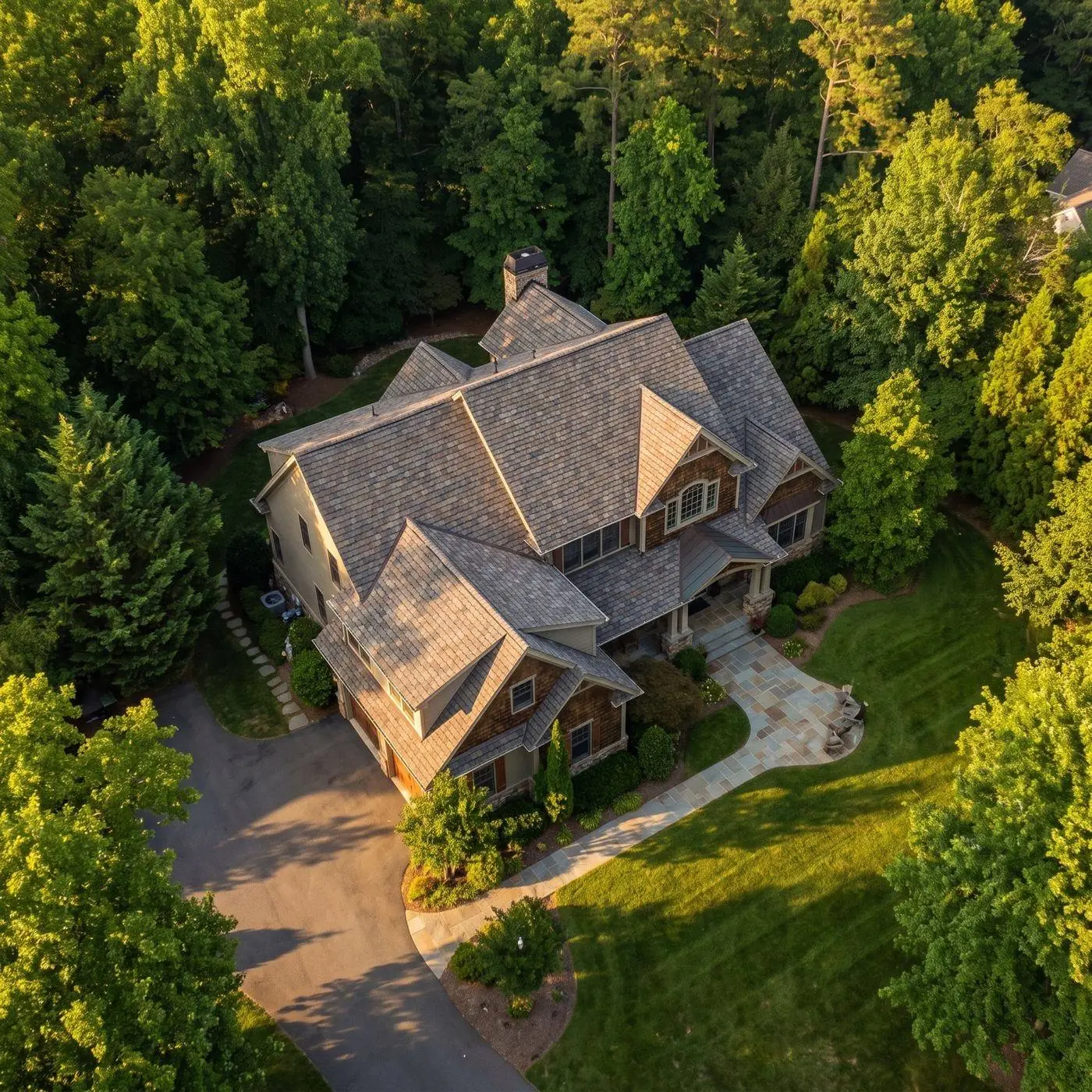 Driftwood color-blend architectural shingles in warm greys and browns